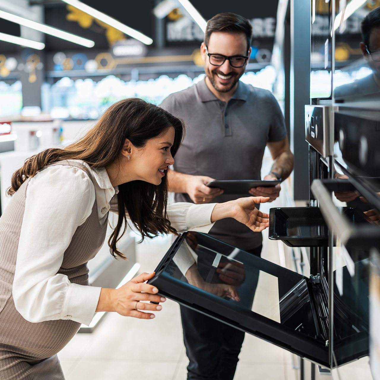 customer in store buying a stove